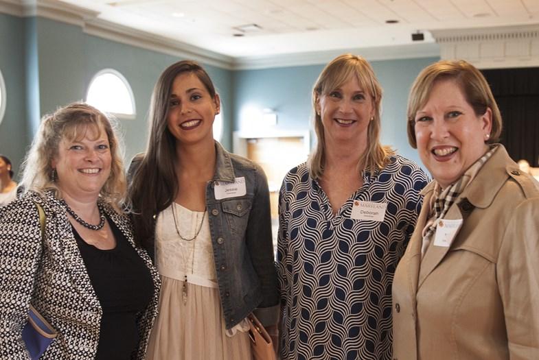 4 women smiling