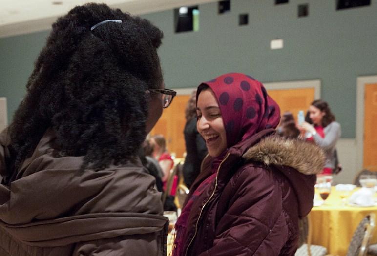 women talking smiling 