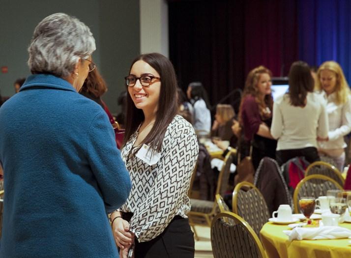 women talking smiling