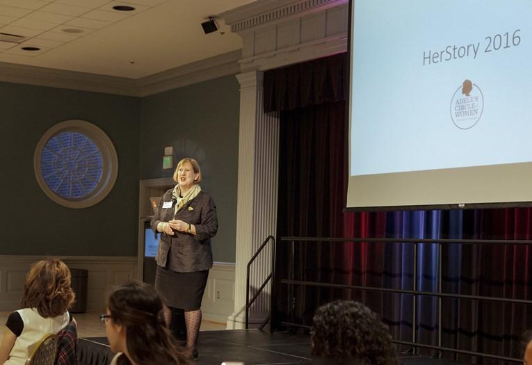 woman speak at podium 