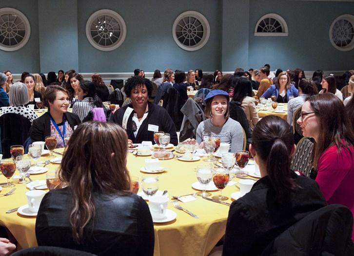 women sitting by table