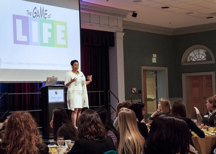 woman speak on stage