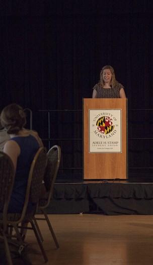 woman speak at podium 